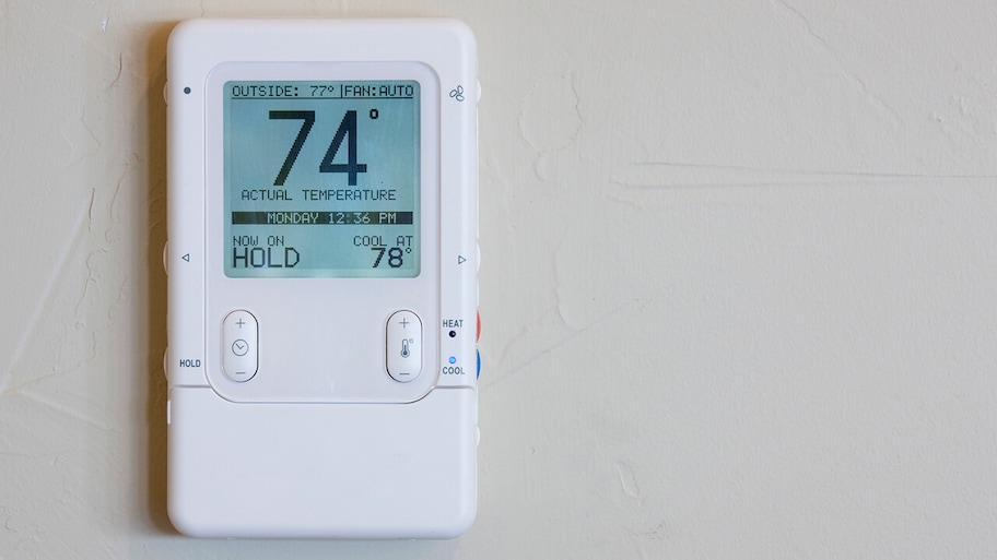 digital home thermostat on wall