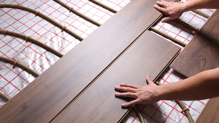 radiant heating system is being installed under floor in home
